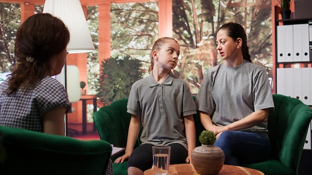 psychologist facilitates family therapy session emotional management